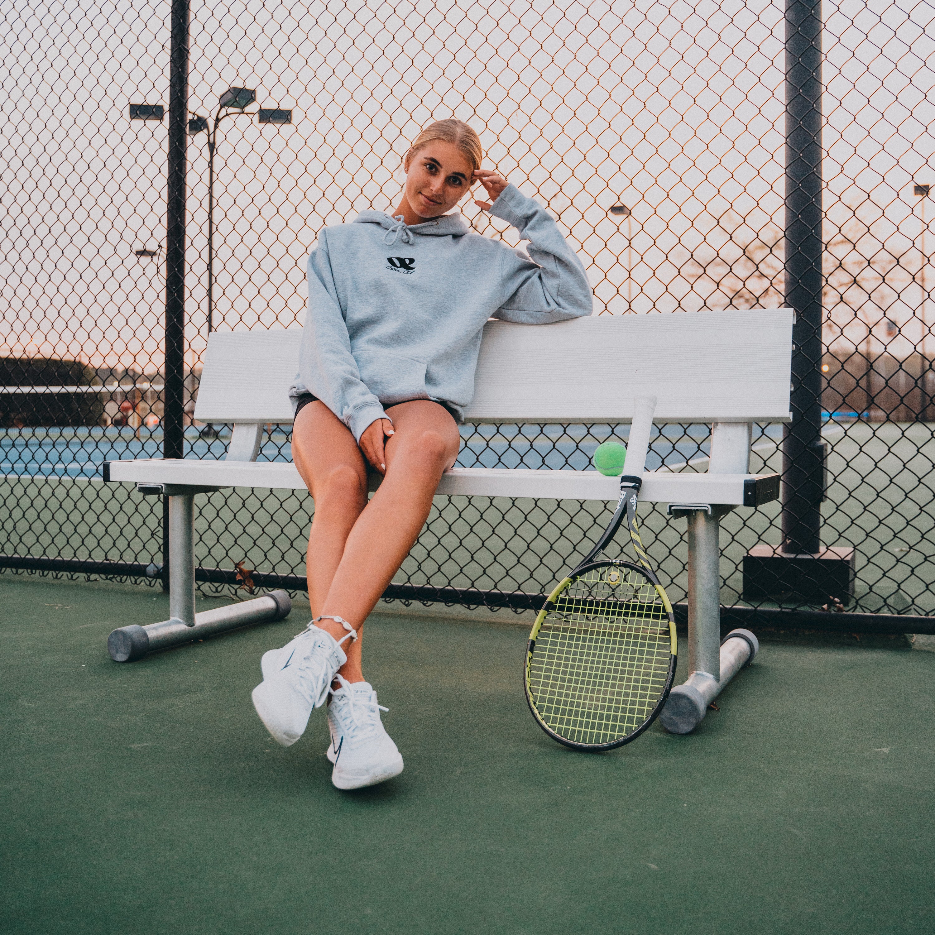 OE Hoodie on Bench on Tennis Courts